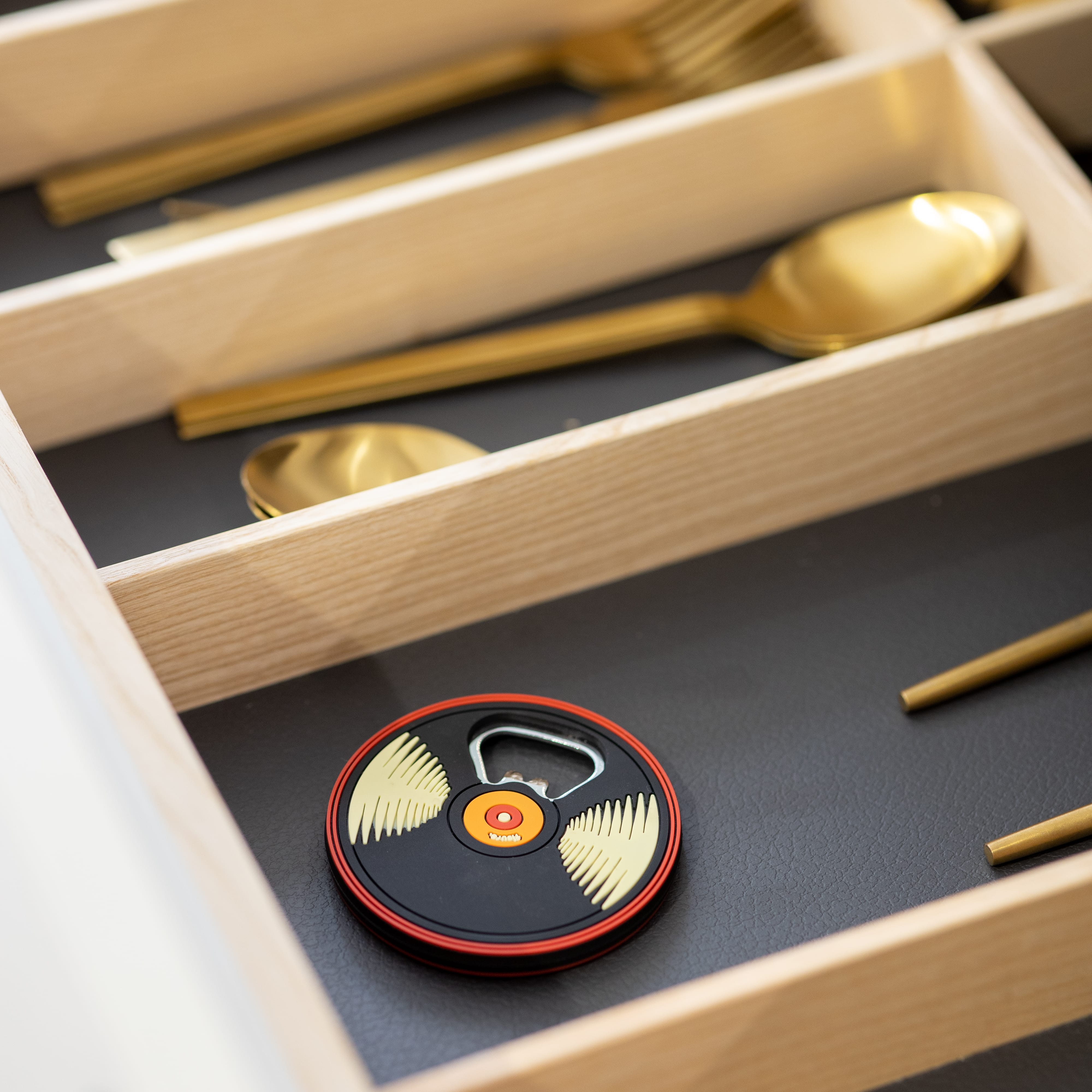 Abridor de botellas "vinilo"