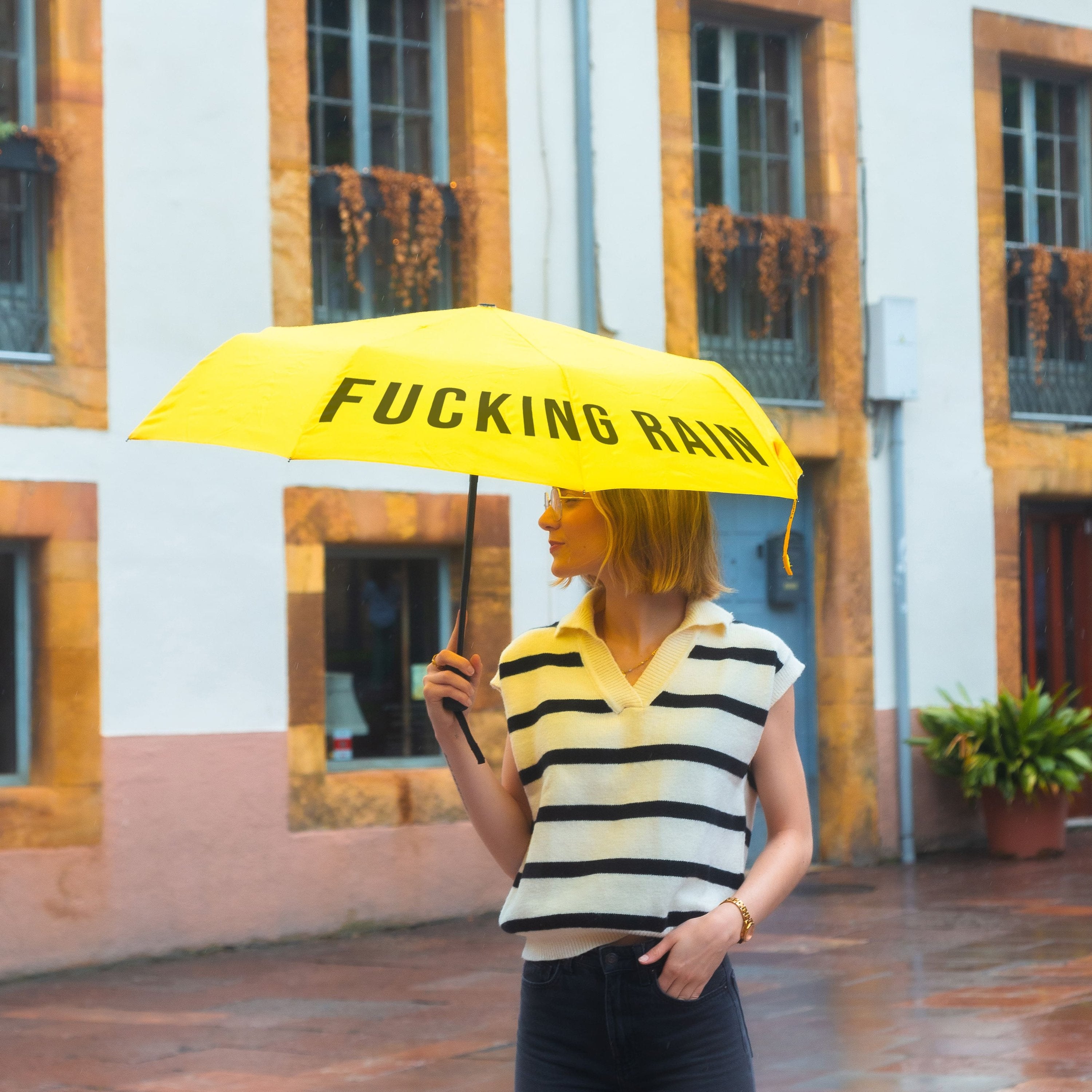 Paraguas plegable "Fucking Rain" amarillo