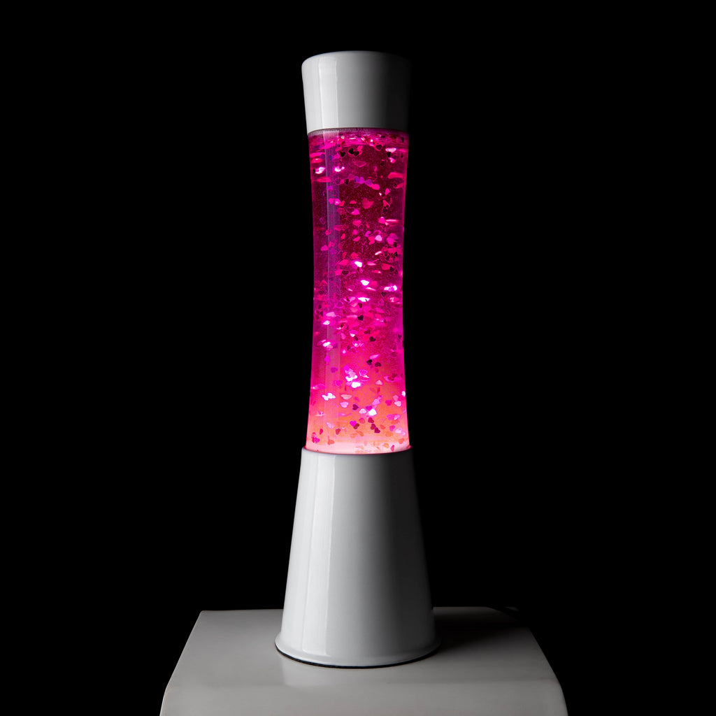 Lámpara de lava con purpurina de corazones con base blanca y líquido rosa